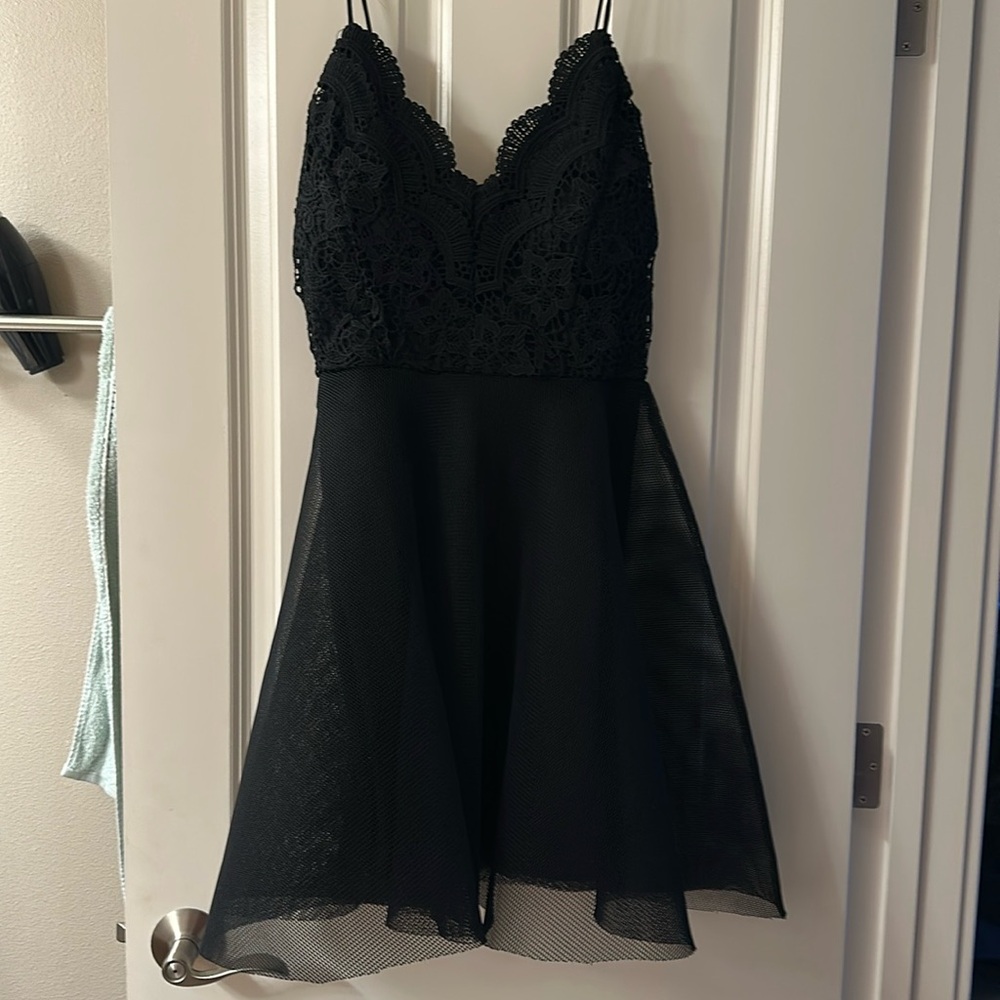 New with tags, never worn black Charlotte Russe dress in medium.